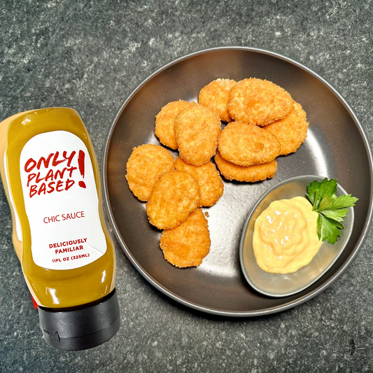 Plant-based chicken nuggets on a plate with a bottle of Only! Plant Based Chic Sauce.