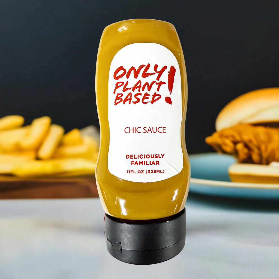 Squeeze bottle of 'Only! Plant Based' Chic Sauce with a burger and fries in the background